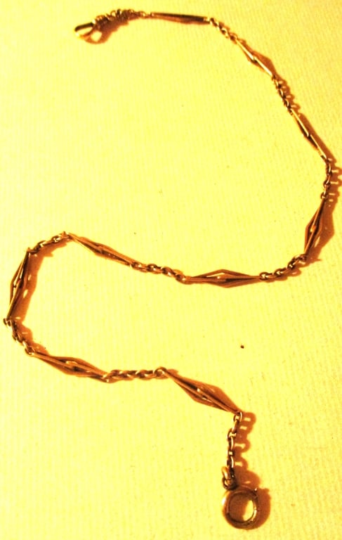 14K Yellow Gold Man's Pocket Watch Chain: Lot Consists of a 14K Yellow Gold Man's Pocket Watch Chain. The Approximate Size is 14" Inches Long. Approximate Weight is 6 dwt. In Good Condition.