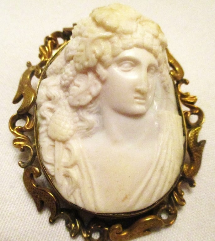 Large Carved Shell Cameo With 10K Gold Setting: Lot Consists of a Large Cameo Brooch/Pendant Carved of a Shell and Set into a 10K Gold Setting. Approximate Size is 2 1/4' Inches Long and Approximately 2" Inches Wide. It Can be Worn as a Brooch or