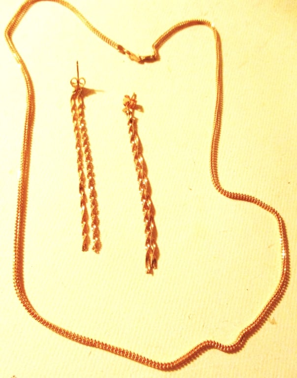 Collection of 22K Gold Jewelry: Lot Consists of a Pair of 22K Gold Earrings and a 22K Gold Neck Chain. Neck Chain Does Not Match Earrings. The Approximate Total Weight is 8.4 dwt. The Approximate Size of the Neck Chain is 20"
