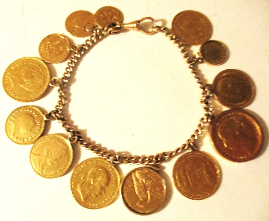 Gold Coin Bracelet: Lot Consists of a Bracelet Made With 13 Gold Coins. Some are Sovereign, Some American, Hungary and More. Approximate Total Weight Including Chain is 36 dwt. In Fair to Good Condition. Approximately 8"