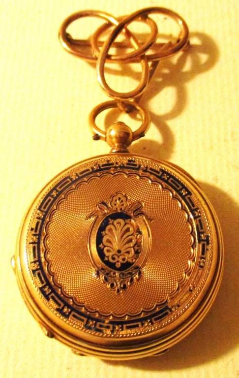 10K Lady's Watch With a Watch Pin: Lot Consists of a 10K Lady's Watch. It is Worn With a 10K Gold Pin. The Watch isn't Working. The Watch is in a Hunter's Case. It is a Wind up, 19th Century, French, Roland is Stamped on the Inside Cas