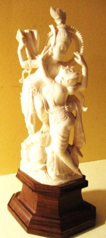 Carving of Hindu Deities Shiva and Parvati: Lot Consists of a Carved Figurine of Hindu Deities Shiva and Parvati. According to the Consignor, They Purchased it on a Trip to India in the 1950's. It Stands on a Wood Pedestal and is Approximately