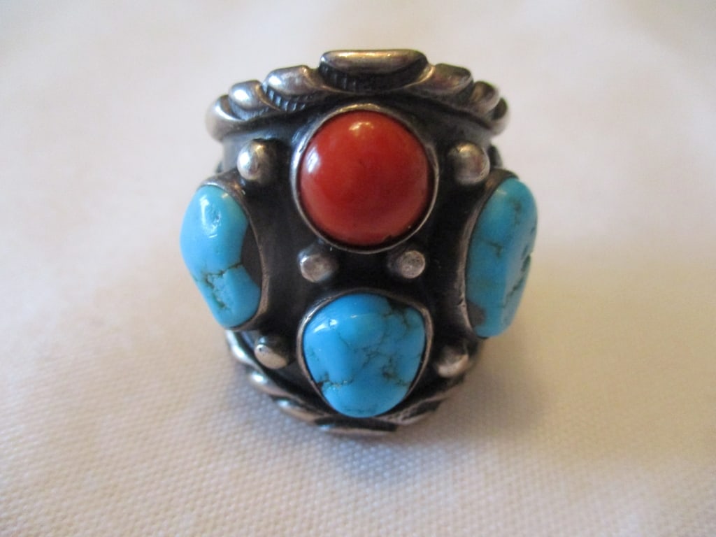 Southwest Navajo Man's Silver Ring w/Stones: Lot Consists of a Southwest Navajo Man's Ring. It is Set With 4 Stones, 3 Turquoise and 1 Coral. Approximate Size is 10. Approximate Weight is 0.5 ozt. In Good Condition.