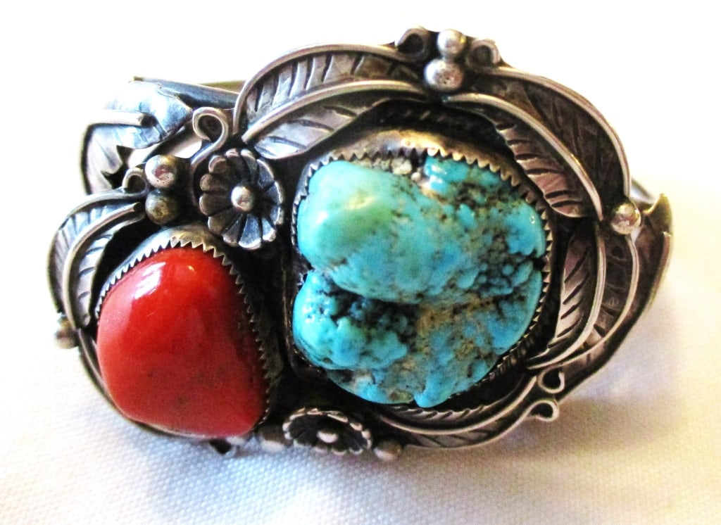 Lady's Southwest Silver Bracelet w/Stones: Lot Consists of a Woman's Southwest Navajo Silver Bracelet. The Approximate Weight is 1.8 ozt. Approximate Diameter is 2 1/2" Inches. Absolutely Wonderful Design With Hand Chasing on the Flower. In Go