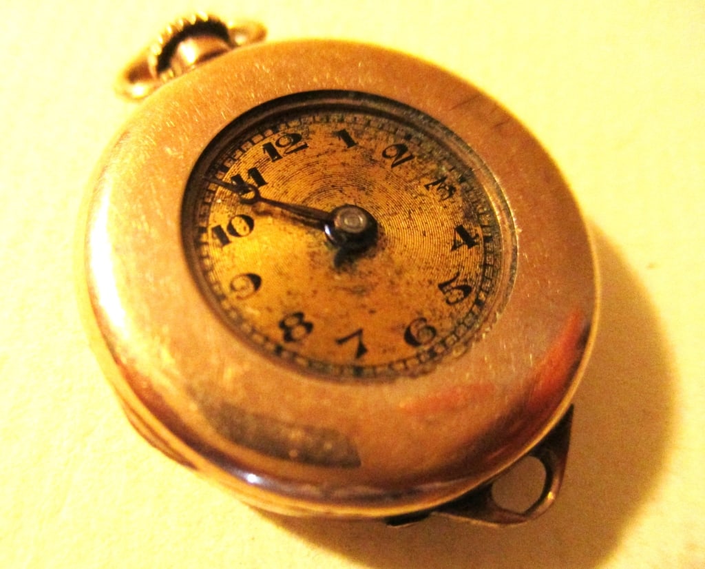 10K Gold Lady's Watch (as is(: This lot consists of a lady's 10k gold watch in as is condition, It is not working