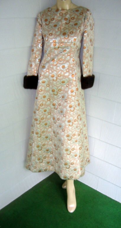 Original Kent Designed Gown for Bonwit Teller: Metallic silk brocade gown with mink cuffs in very good condition. Ca. 1960's.