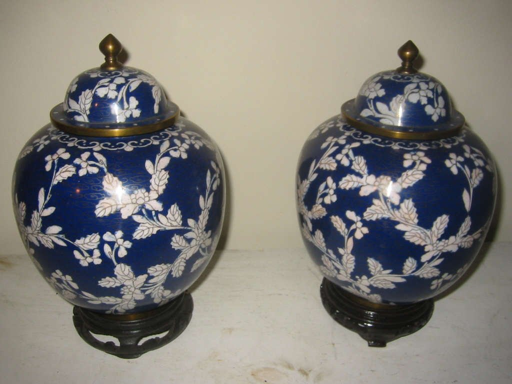 Pair of Blue and White Cloisonne Ginger Jars: Pair of blue and white covered ginger jars. Chinese and in very good condition. Stands are not matching.