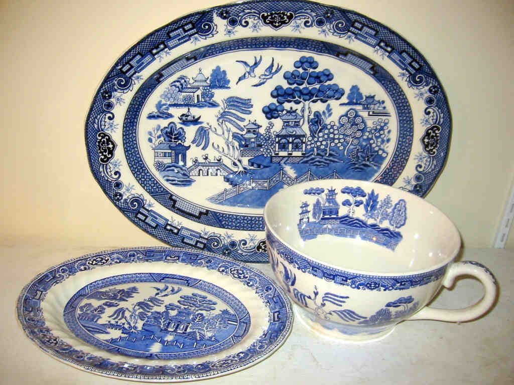 Lot of 3 Pieces of Willow Ware: Three piece lot of Willow Ware China - a large bowl with handle and two platters. Larger platter is 18", small is 12" and bowl is 9". All in good condition.