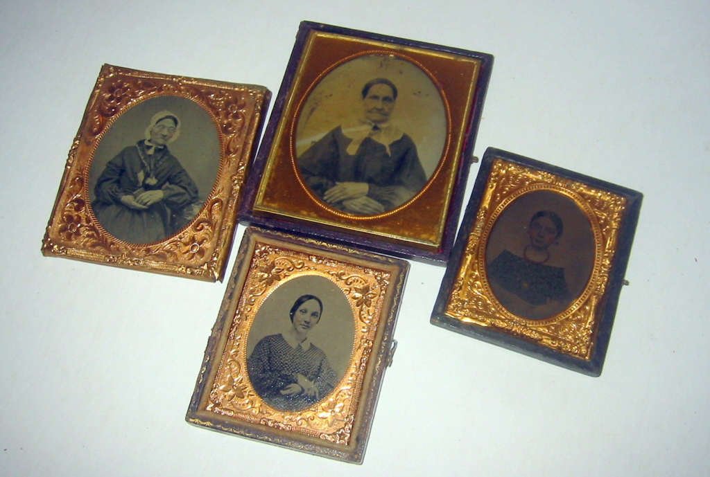 Lot of 4 Old Daguerreotype/Ambrotype of Women: Four antique daguerreotype/ambrotypes of women. All are missing part of cases. The images are in good to fair condition.