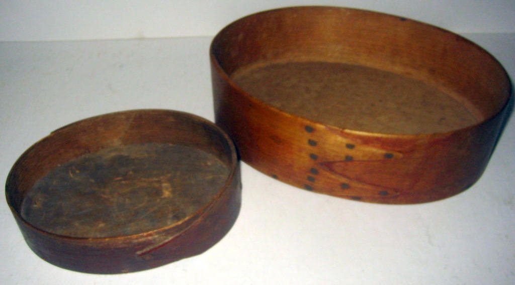 Two Shaker Pantry Boxes (As Is): Two Shaker pantry boxes without covers. The boxes are oval shape and are in good condition except for having no covers. 8 3/4" x 5 1/2" and smaller one is 5 1/4" x 4" across oval.