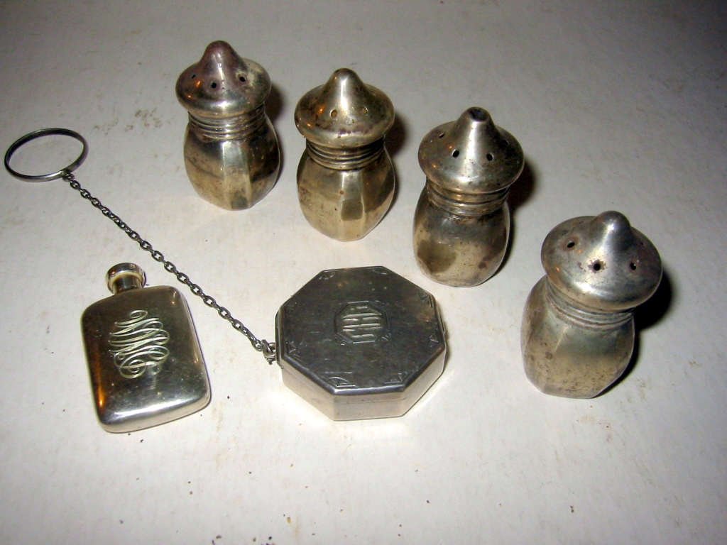 Lot of Miscellaneous Sterling Items: Four miscellaneous sterling salt and pepper shakers, sterling perfume and sterling pill box. All in good condition.