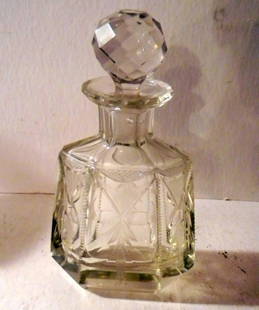 Cut Glass Cologne Bottle: Wonderful cut glass cologne bottle in good condition. Very heavy cut glass with a polished base. 7 1/2" tall.