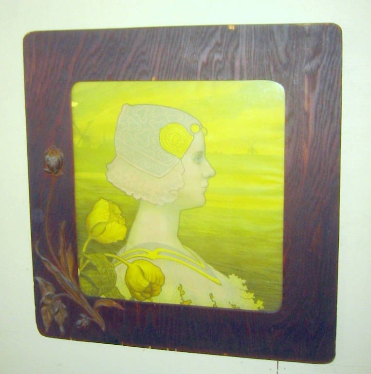 Berthone Print in Original Art Nouveau Frame: Paul Berthon print in original art nouveau frame with applied floral motif. Frame has a few minor chips on rim and print has small tear. Unsigned and in otherwise good condition. Rare to find with ori