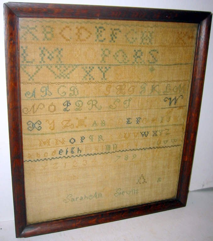 Early American Sampler: Early American sampler by Sarah Ann Stevens. In overall good condition with some fading, C.a. 1830. Framed under glass, size is approx. 14 1/2" x 12 1/2" end to end.