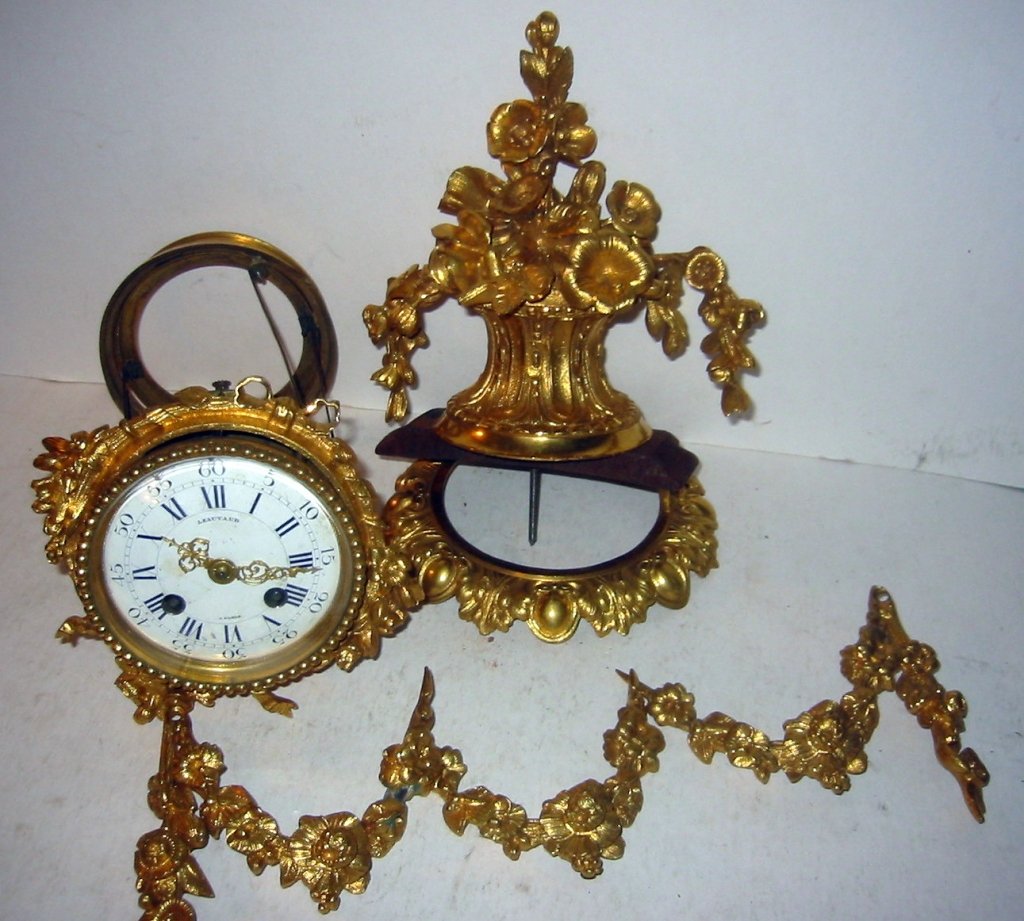 French Ormolu Clock Works and Mounts: French Ormolu clock works by Leautaud, Paris and the bronze Ormolu mounts. All in very good condition. The finest clock mounts and works, six pieces in all. Gilding is in very good condition.