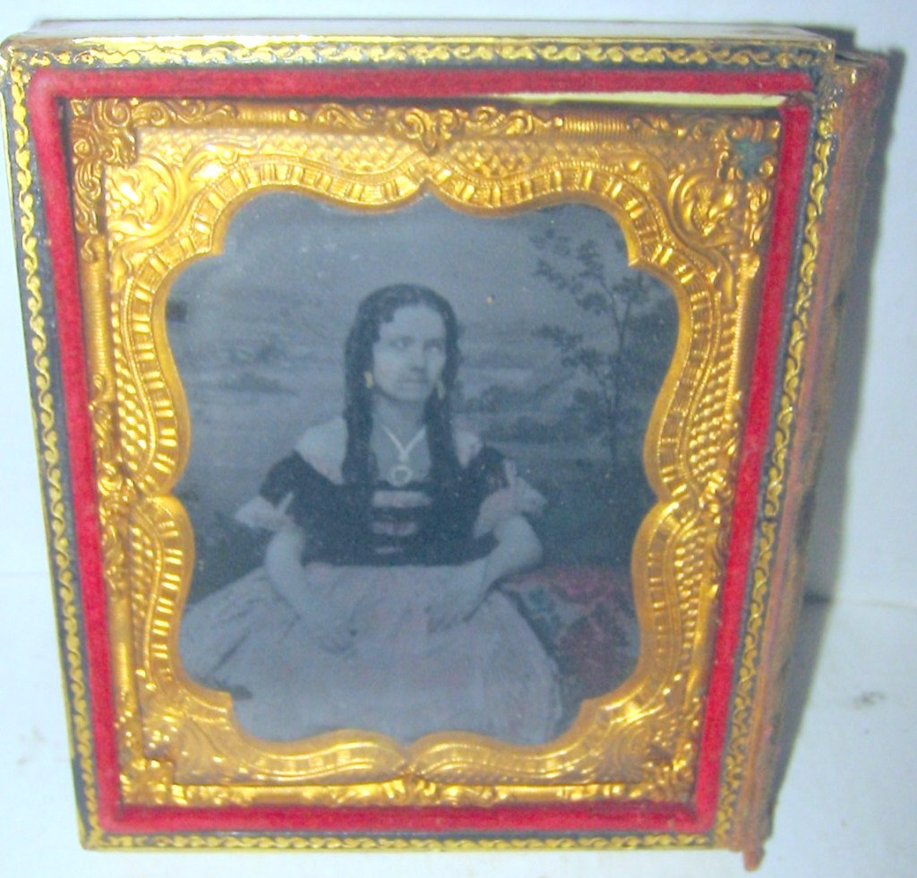 Ambrotype of Mexican Man and Young Wife: This ambrotype is in a double case with papier-mache covers. Unfortunately, only one cover is with the case. Ambrotypes depict a very wealthy man and his young bride.Look to be of Mexican origin, Phot