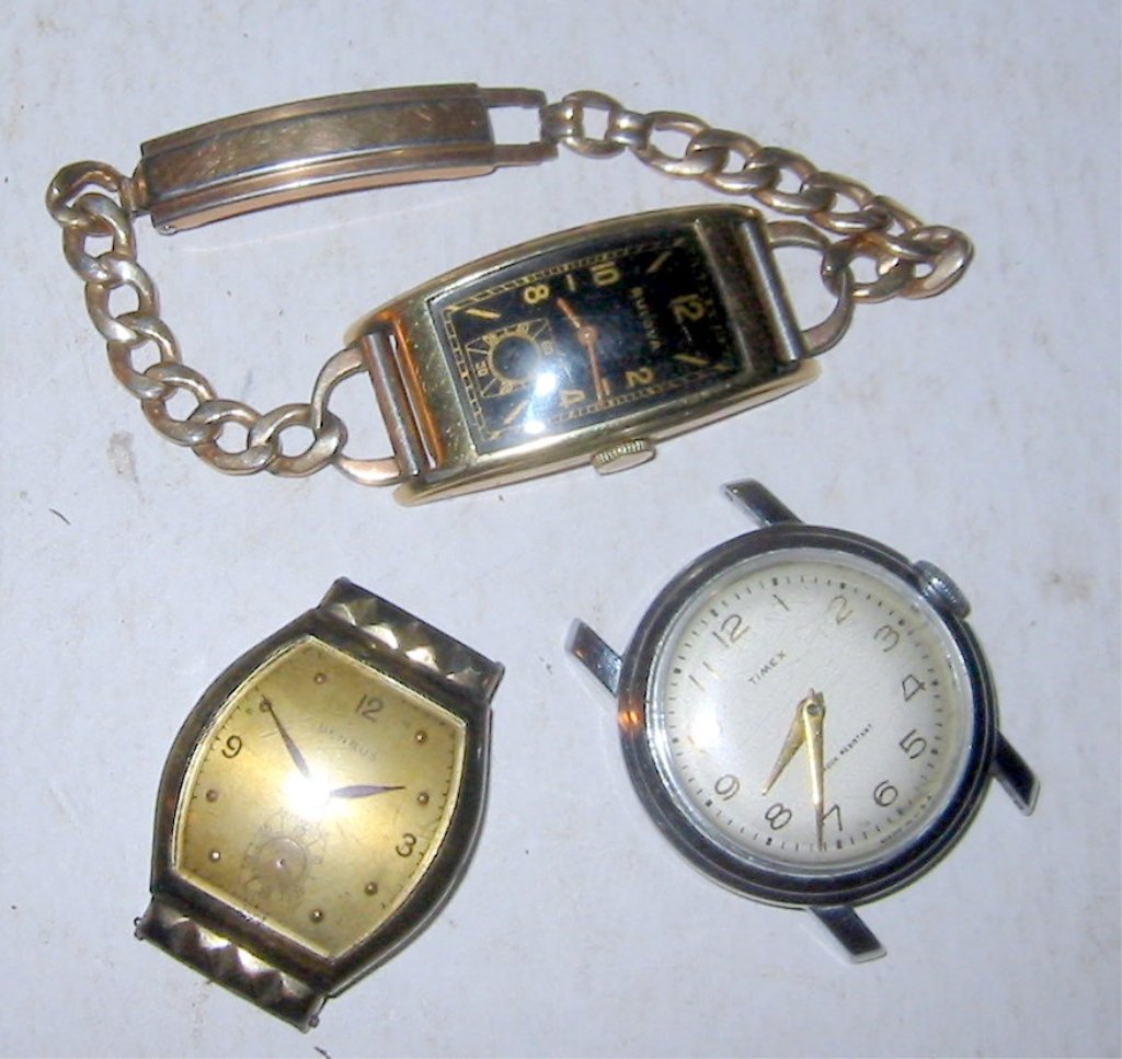 Lot of Three Men's Vintage Watches: Lot of three men's vintage watches. One Bulova gold filed curvex type, one Benrus, and one Timex (still ticking). Working?