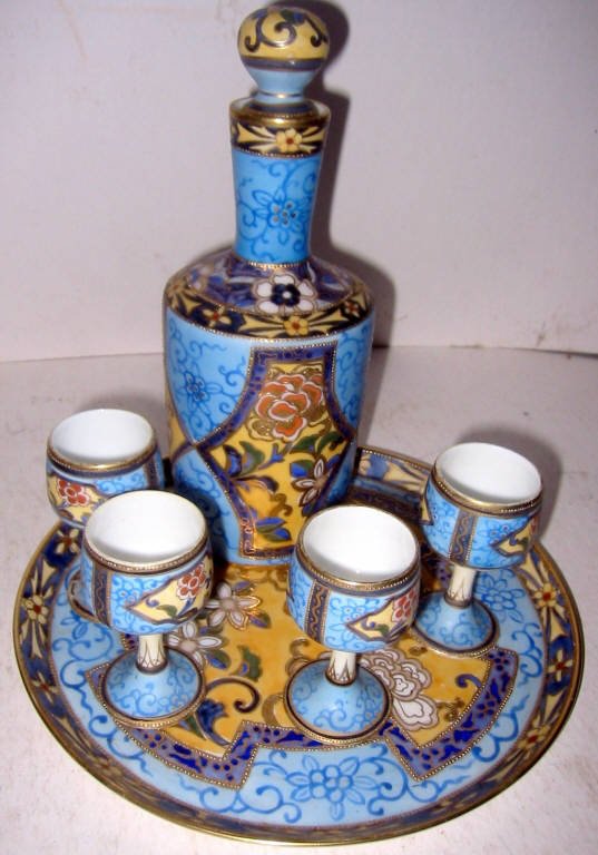 Nippon Liquor Set: Hand painted Nippon liquor set good condition. Four cups and bottle.