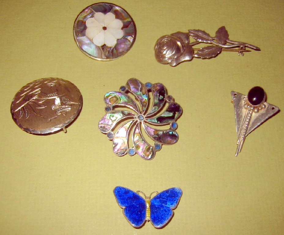 Lot of Six Sterling Pins: Lot of six sterling pins, some with enamel and some with abalone. All in good condition.