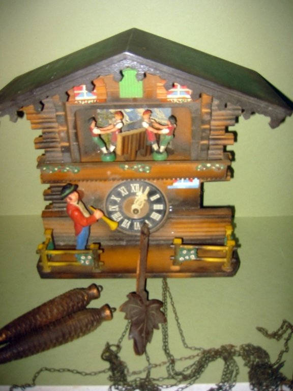 German Automaton Cuckoo Clock: German automaton cuckoo clock, with wood figures that move when the clock strikes, Do not know if it is working,