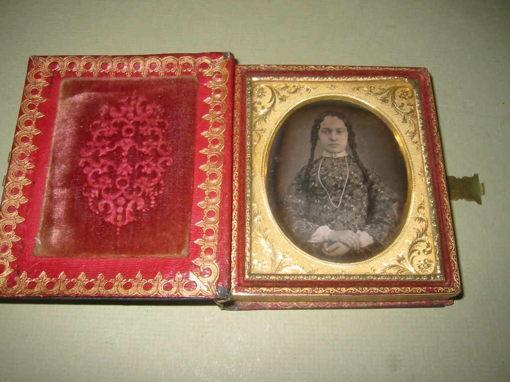 19th Century Daguerreotype in Papier Mache Case: 19th century daguerreotype of what looks to be a ethnic American woman. Set in a beautiful paper mache case with Mother of Pearl inlay. In good condition, image is clearly visible.