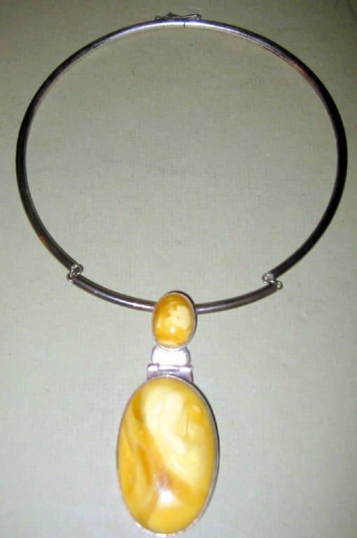 Sterling Silver and Butterscotch Amber Choker: Sterling silver choker hallmarked and set with two pieces of butterscotch amber in good condition.
