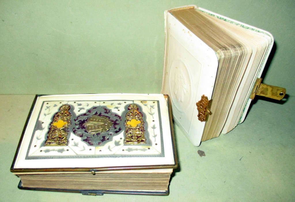 Two Judaica Bibles Ca. 1900: Two Judaica Bibles in fair to good condition. The larger one is set with silver and gold plate decoration. The celluloid spine cover is missing. The other cover is just celluloid. Ca. 1900.