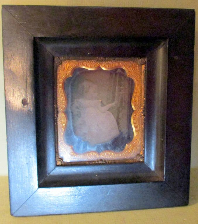 Ambrotype of Victorian Baby: Framed Ambrotype of Victorian baby measures 6" x 5" end to end of frame. Lot is in fair to good condition.