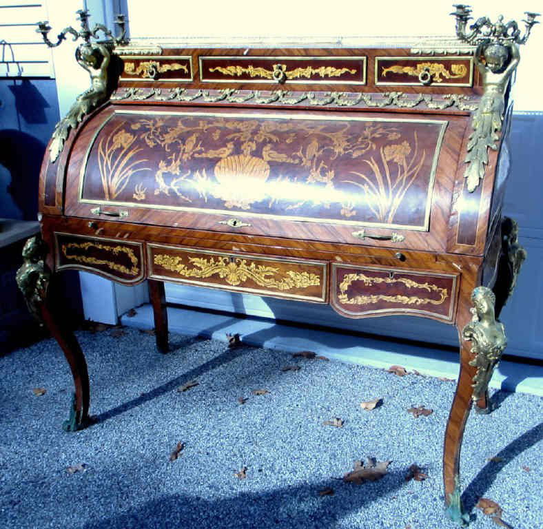 Louis XIV Style French Cylindrical Roll Secretary: A mid-century reproduction of a Louis XIV style desk with a cylinder roll top with bronze mounts. Needs restoration, veneer is missing and some pieces need to be glued.