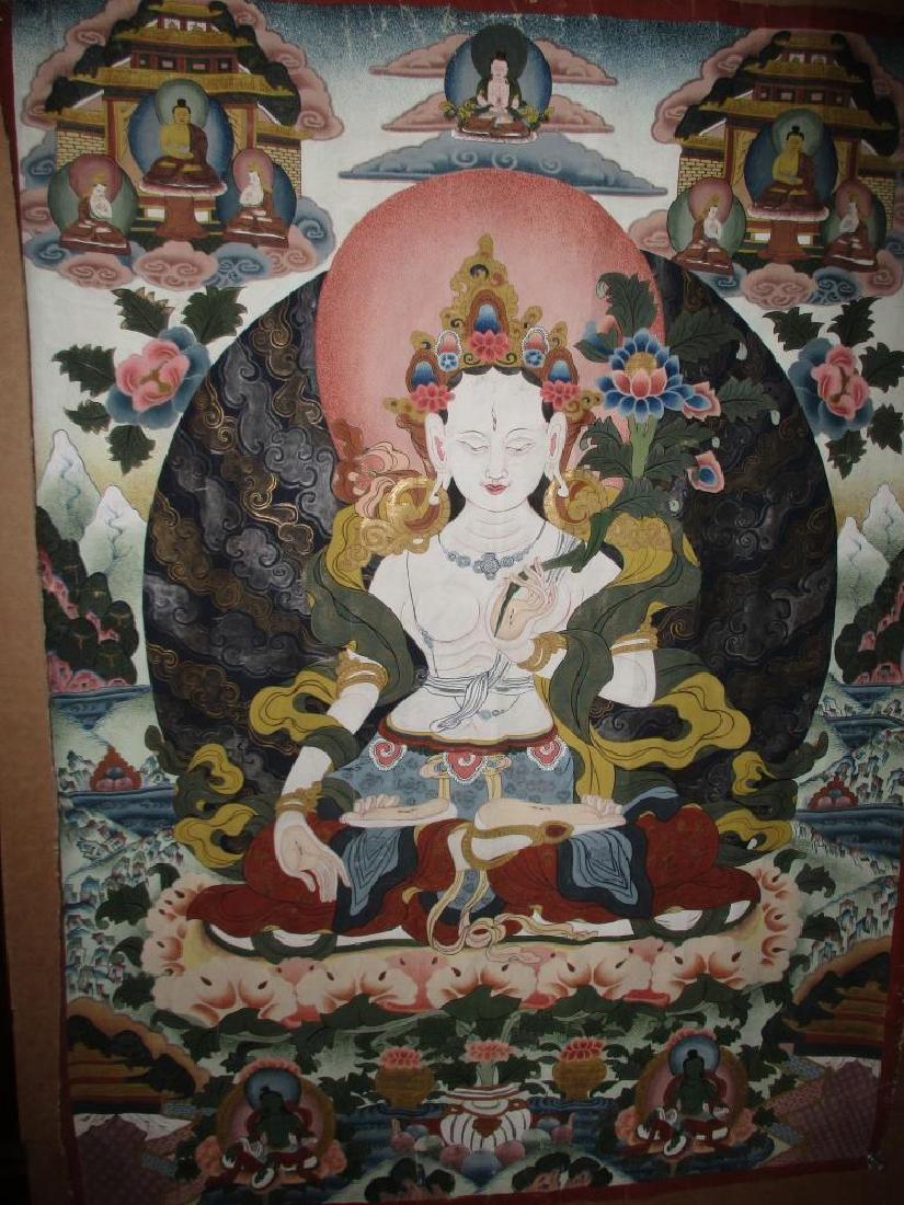 Signed Asian Tanka: Signed Asian tanka depicting a Buddha, c.a. 1900, in good condition. Has a signature on back and a red wax seal. Measures 31" x 22". Origin is most likely India or Indonesia.