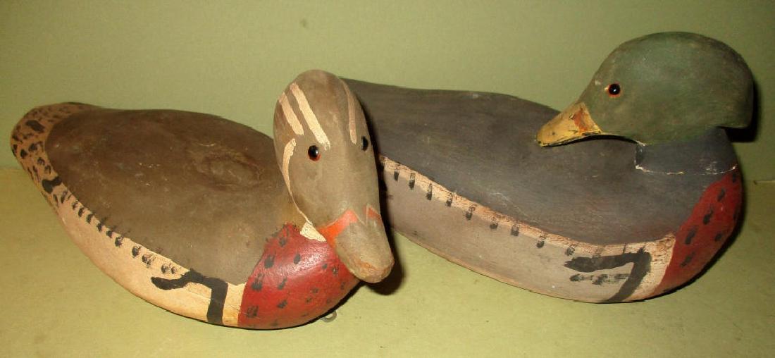 Two Mid-Century Decoys by Randall: Two mid-century decoys by Randall in good condition. One is 7" x 14" long and the other is 7 1/2" x 13" long.