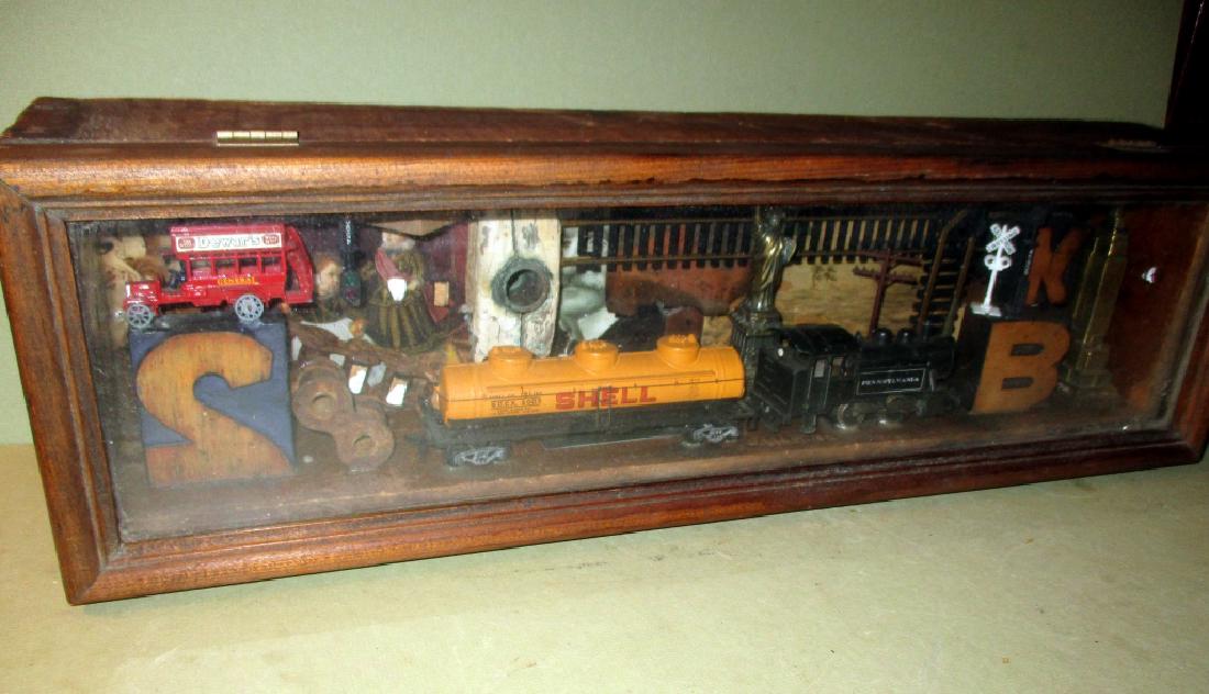 Shadow Box Sculpture by Dedra Delano Stead: Shadow box sculpture by Dedra Delano Stead, of children's toys, in good condition, measures 21" in long x 6 1/2 "in tall x 4 1/2" deep, Label on back