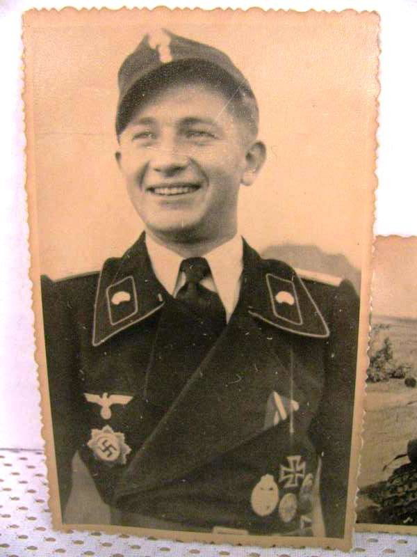 3 WW II private photos. One is of a young German A: 3 WW II private photos. One is of a young German Army lieutenant wearing his black Panzer wrap uniform. His medals are the German Cross in Gold. The Panzer Assault Badge. A Iron Cross 1st class, a wou