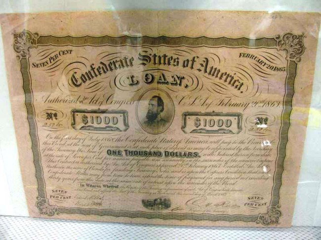 1863 $1,000 Confederate States Bond w/7 Attached I: 1863 $1,000 Confederate States Bond w/7 Attached Interest Coupons. Central Vignette Depicts Lt. General Thomas J. "Stonewall" Jackson. Mortally wounded on May 2, 1863 at Chancellorville, VA