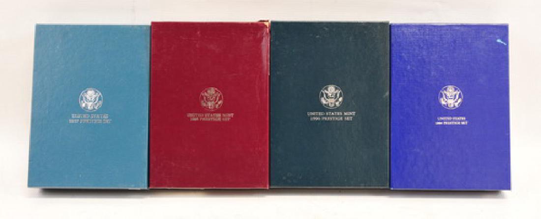 United States Prestige Sets 86 87 88 90: United States Proof Prestige Coin Sets 1986 Statue of Liberty, 1987 Constitution set, 1988 Olympic Set and 1990 Eisenhower Set.