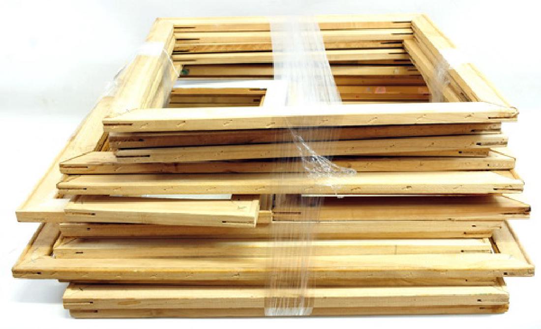 Over 75 picture frames: made of wood, metal and some with glass in them.