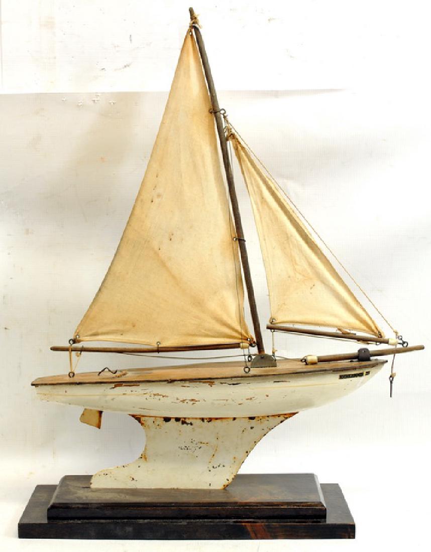 Two antique pond sail boats: White and brown, 19" X 23", Green and brown 14" X 17".