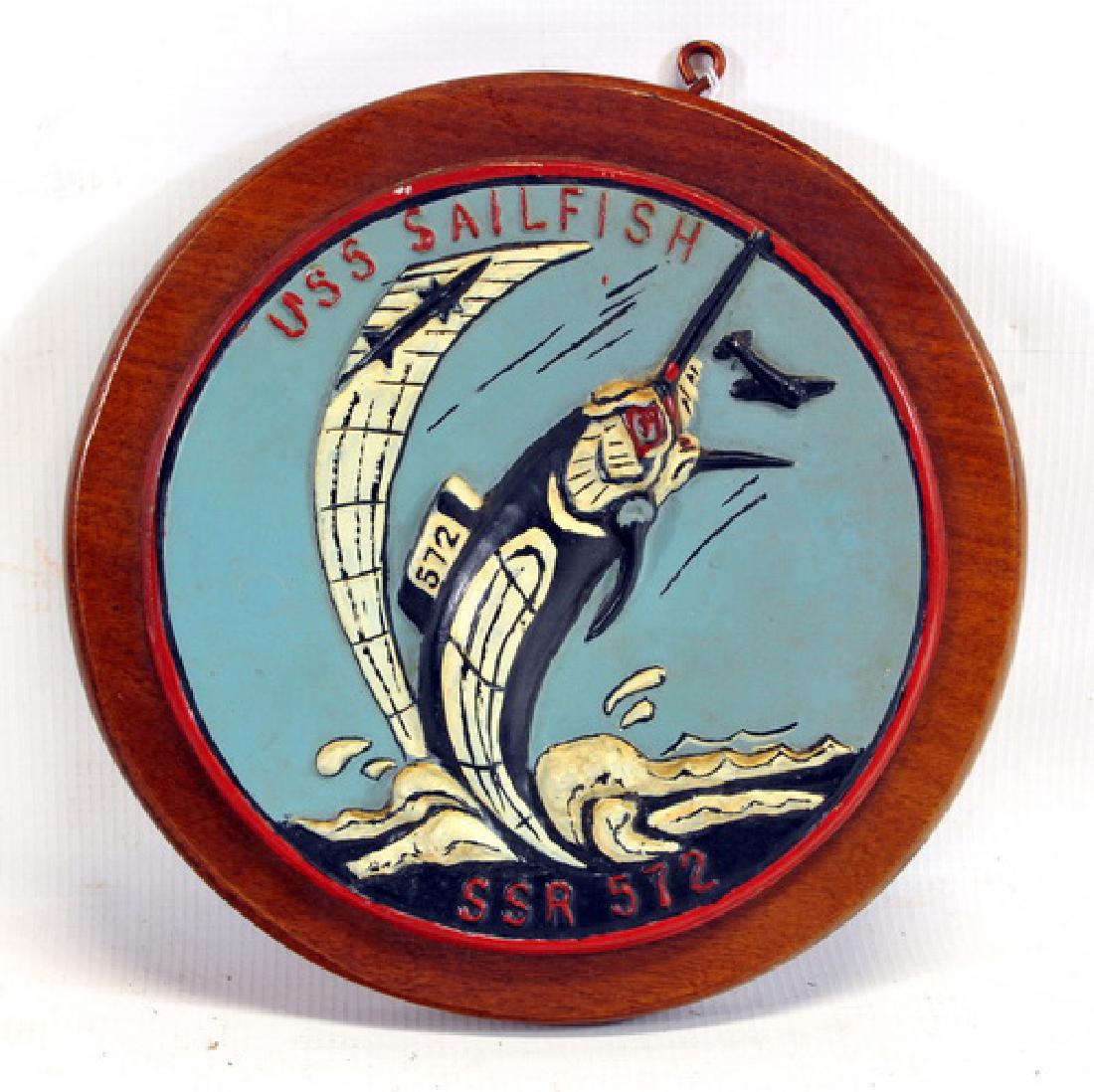 Original USS Sailfish SSR 572: wooden circular plaque, hand painted with inscription to the launching crew in pencil on the back: "To the most wonderful people in the world, I'll never forget the rainbow", Harry Thomas R Milss, Aug