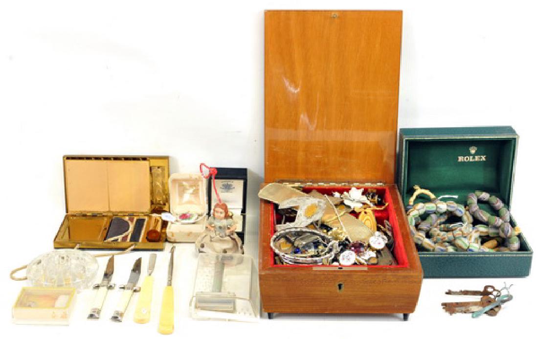 African trading beads, West Germany Knives: costume jewelry colorful pins, floral brooches, cuff links, bracelets, necklaces and more. Vintage cigarette powder and lipstick purse, Portland ME funeral home pocket knife, Skelton keys, and a Cellu