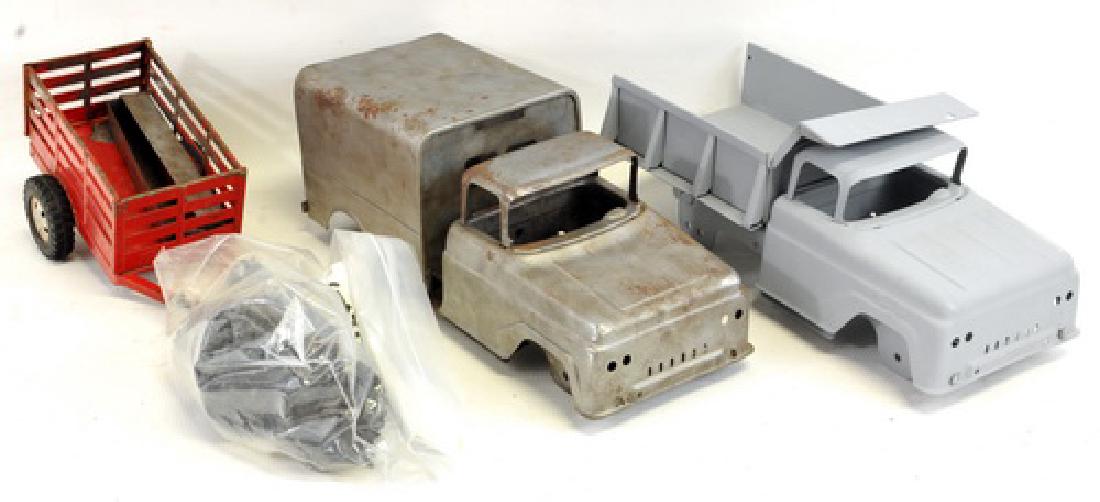 Three Boxes Of Pressed Steel Toy Truck Parts