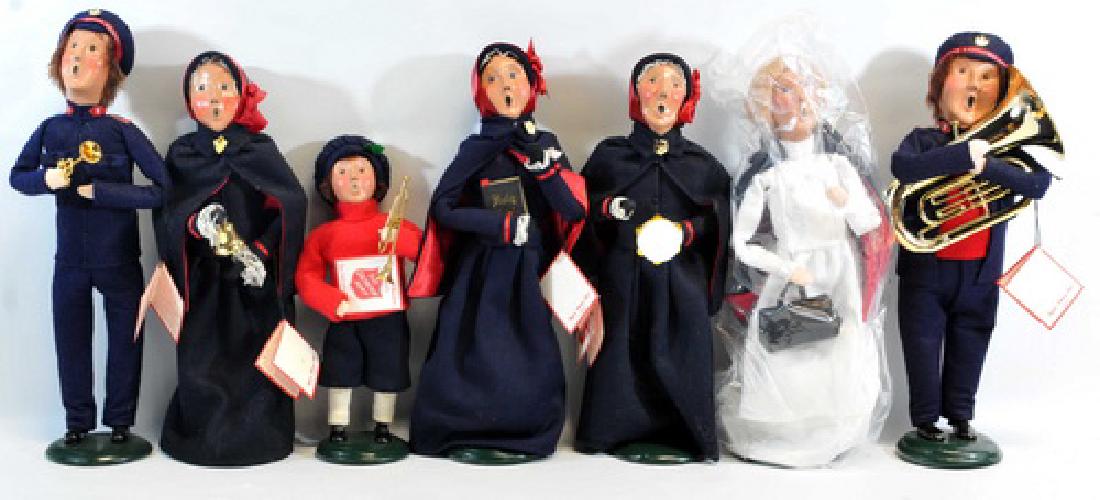 21 Byers Choice Ltd.: Caroler with trumpet, Caroler with Bible, Caroler with Dinnerware set, Caroler with gingerbread man, and more