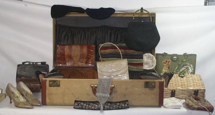 Suitcase full of purses and shoes: Suitcase full of purses and shoes