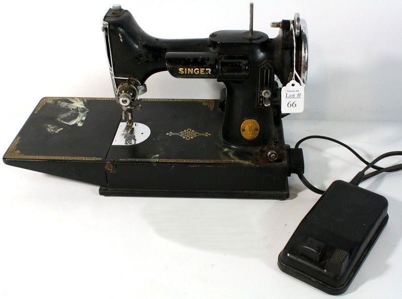The Singer Manufacturing Company Sewing machine bla: The Singer Manufacturing Company Sewing machine black with attached cord