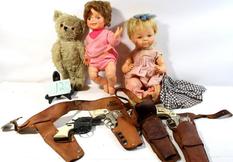 Vintage toys to include guns with holsters, two do: Vintage toys to include guns with holsters, two dolls and one off white teddy bear with movable legs and arms