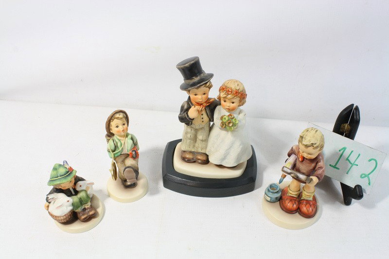Four Hummels in boxes depicting, "Boy with bunnies: Four Hummels in boxes depicting, "Boy with bunnies" "Wedding Couple" "Boy with Umbrella" " Little boy with Art pictures"