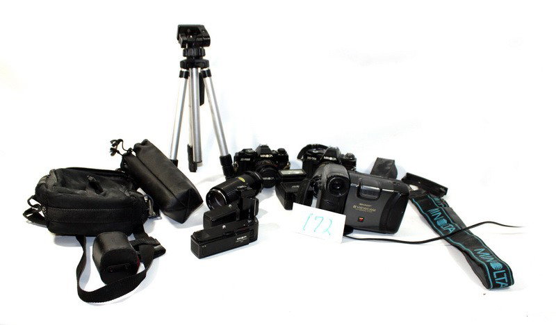 Camera lot with Minolta: Minolta X-7A 35mm Camera with 80-200 Zoom Lens, Minolta X-700 35mm Camera with50mm Lens, Tokina 80-200 Zoom Lens, Vivitar TeleConverter, Sharp VHS-C Video Camera, 2 Minolta Motor Drives and a Floor Le