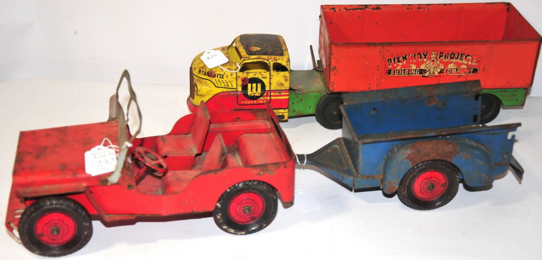 Red tin Willy's Jeep 10"long with blue trailer 10": Red tin Willy's Jeep 10"long with blue trailer 10" long and Wyandotte truck 16" length called Pickway Projects Building Company