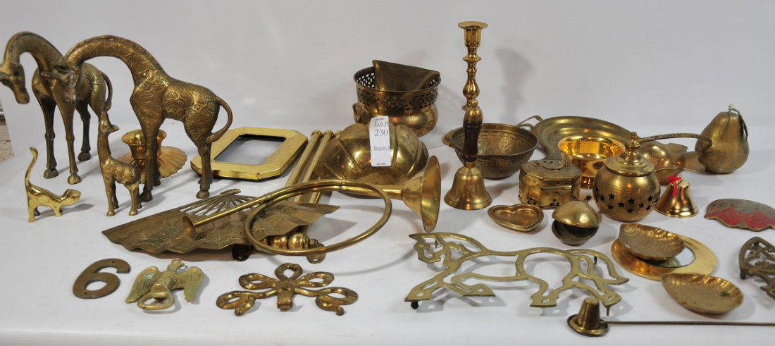 Box of bra figures to include a pair of giraffes,: Box of bra figures to include a pair of giraffes, candle holders, a pear, decorative pieces