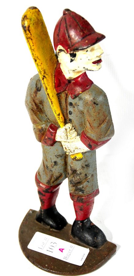 Baseball player doorstop with yellow bat, gray an: Baseball player doorstop with yellow bat, gray and red playing suit with red hat