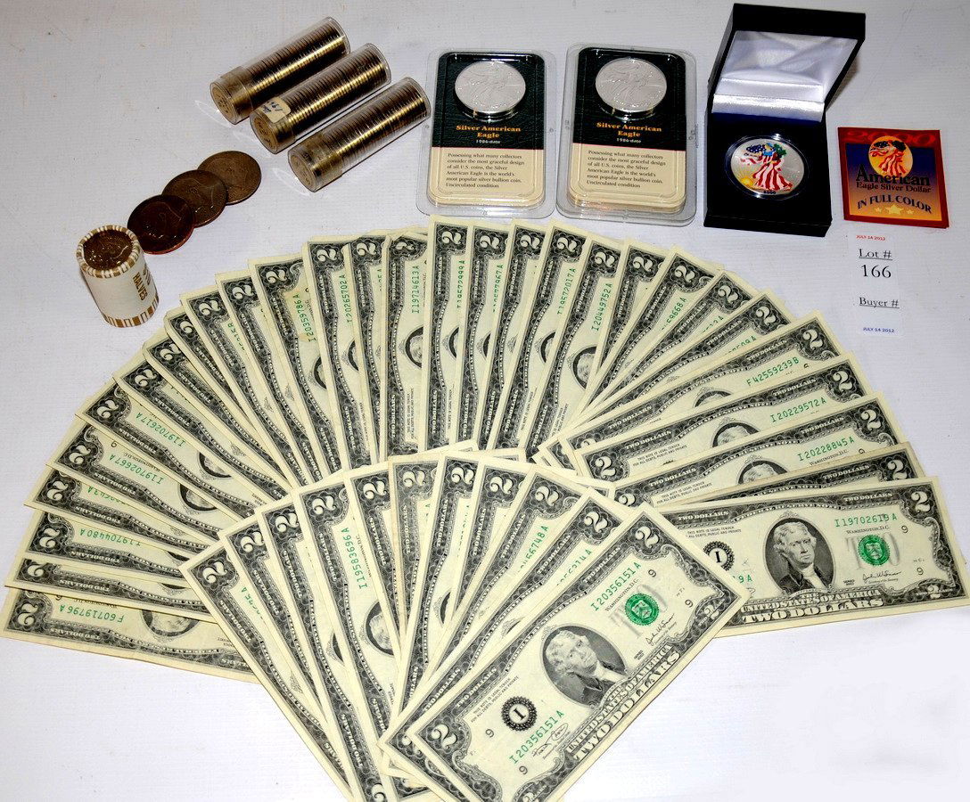 Collection of Coins to include 4 American Silver E: Collection of Coins to include 4 American Silver Eagles, 44 $2 Bills, 3 rolls of Unc Jefferson Nickles, roll of Kennedy Halves and 3 Ike Dollars